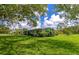 Side view of ranch house with large backyard at 5310 N Tuttle Ave, Sarasota, FL 34234