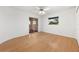 Spacious bedroom with hardwood floors and sliding glass doors to balcony at 4323 Rock Creek Dr, Port Charlotte, FL 33948
