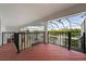 Deck overlooking pool and canal with a spiral staircase at 4323 Rock Creek Dr, Port Charlotte, FL 33948