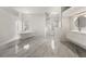 Luxurious bathroom with a freestanding tub, marble floors, and walk-in shower at 4323 Rock Creek Dr, Port Charlotte, FL 33948