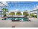 Enclosed pool and spa with a view of the waterway at 4323 Rock Creek Dr, Port Charlotte, FL 33948
