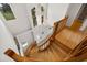Elegant wooden spiral staircase leading to upper levels at 4323 Rock Creek Dr, Port Charlotte, FL 33948