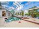 Inviting screened pool and spa overlooking the canal at 4323 Rock Creek Dr, Port Charlotte, FL 33948