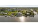 Aerial view of waterfront home with boat slips and expansive canal views at 4323 Rock Creek Dr, Port Charlotte, FL 33948