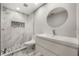 Modern bathroom with marble shower and floating vanity at 4323 Rock Creek Dr, Port Charlotte, FL 33948