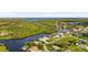 Bird's eye view of waterfront property and surrounding homes at 4323 Rock Creek Dr, Port Charlotte, FL 33948