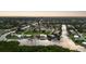 Wide aerial showcasing the property's waterfront location and neighborhood at 4323 Rock Creek Dr, Port Charlotte, FL 33948