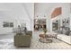 Bright and airy living room with a comfortable seating area and view into the kitchen at 4323 Rock Creek Dr, Port Charlotte, FL 33948