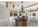 Island kitchen with granite countertop, stainless steel appliances, and a large hood at 4323 Rock Creek Dr, Port Charlotte, FL 33948