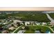 Aerial view of waterfront property with lush landscaping and canal views at 4323 Rock Creek Dr, Port Charlotte, FL 33948