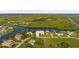 Waterfront property with lush landscaping and canal access at 4323 Rock Creek Dr, Port Charlotte, FL 33948