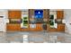 Modern kitchen with wood cabinets, granite countertops and a wine cooler at 4323 Rock Creek Dr, Port Charlotte, FL 33948