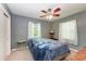 Bright bedroom with a ceiling fan, window, and double bed at 1410 21St W St, Bradenton, FL 34205