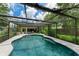 Large swimming pool with screened enclosure at 1410 21St W St, Bradenton, FL 34205