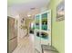 Modern kitchen with white cabinets, stainless steel appliances and light flooring at 1410 21St W St, Bradenton, FL 34205