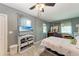 Bedroom with a large bed, TV, and plenty of storage at 1410 21St W St, Bradenton, FL 34205