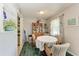 Charming dining area with a round table and four chairs, plus built-in hutch at 1410 21St W St, Bradenton, FL 34205
