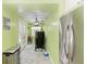 Modern kitchen with white cabinets, stainless steel appliances, and light flooring at 1410 21St W St, Bradenton, FL 34205