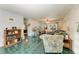 Spacious living room with green tile floors, comfortable seating, and natural light at 1410 21St W St, Bradenton, FL 34205