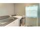 Bright laundry room complete with washer and dryer at 1410 21St W St, Bradenton, FL 34205