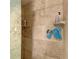 Large shower with beige tile and built-in shelving at 1410 21St W St, Bradenton, FL 34205