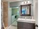 Main bathroom with double vanity and laundry access at 1410 21St W St, Bradenton, FL 34205