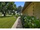 Brick walkway alongside the home, leading to the entrance at 1525 17Th W St, Palmetto, FL 34221