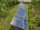 Ground-mounted solar panels in the backyard at 1525 17Th W St, Palmetto, FL 34221