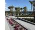 Landscaped pickleball courts with shaded seating areas offer residents a space for recreation and social gatherings at 1217 Blue Shell Loop, Sarasota, FL 34240