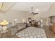 Living room with hardwood floors, vaulted ceiling and view into kitchen at 4521 Kingsmere # 6, Sarasota, FL 34235