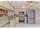 Well-equipped kitchen with stainless steel appliances at 4521 Kingsmere # 6, Sarasota, FL 34235