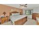 Spacious bedroom with wood furniture and carpeting at 4521 Kingsmere # 6, Sarasota, FL 34235