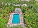 Community pool with lounge chairs and surrounding landscape at 4521 Kingsmere # 6, Sarasota, FL 34235