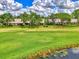 Aerial view of community near golf course and water at 4521 Kingsmere # 6, Sarasota, FL 34235