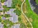 Aerial view of community featuring homes, landscaping, and a golf course at 4521 Kingsmere # 6, Sarasota, FL 34235