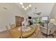 Spacious living room with vaulted ceilings, hardwood floors, and access to patio at 4521 Kingsmere # 6, Sarasota, FL 34235
