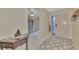 Bright entryway with tile floors and view of kitchen at 4521 Kingsmere # 6, Sarasota, FL 34235