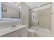Clean bathroom with a large mirror, a bathtub and a white vanity at 4521 Kingsmere # 6, Sarasota, FL 34235