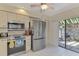 Kitchen with stainless steel appliances and patio access at 4521 Kingsmere # 6, Sarasota, FL 34235