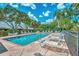 Inviting community pool with surrounding patio furniture at 4521 Kingsmere # 6, Sarasota, FL 34235