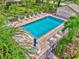 Relaxing community pool area with plenty of lounge chairs at 4521 Kingsmere # 6, Sarasota, FL 34235