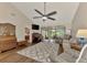 Living room with hardwood floors, vaulted ceiling and view of kitchen at 4521 Kingsmere # 6, Sarasota, FL 34235