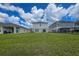 Large backyard with grassy area and houses at 12925 Oak Hill Way, Parrish, FL 34219