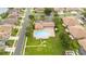 Community swimming pool with surrounding lounge chairs and landscaping at 4405 Lenox Blvd, Venice, FL 34293