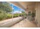 Relaxing screened porch with seating and ceiling fan at 4405 Lenox Blvd, Venice, FL 34293