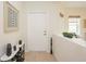 Modern entryway with a sleek design and neutral color palette at 4405 Lenox Blvd, Venice, FL 34293