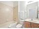 Clean bathroom with tub, toilet, and vanity at 4405 Lenox Blvd, Venice, FL 34293