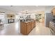 Open concept kitchen with island and granite countertops at 4405 Lenox Blvd, Venice, FL 34293
