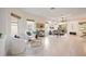 Open concept living room with tile floors and access to the patio at 4405 Lenox Blvd, Venice, FL 34293