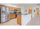 Spacious kitchen featuring stainless steel appliances and an island at 4405 Lenox Blvd, Venice, FL 34293